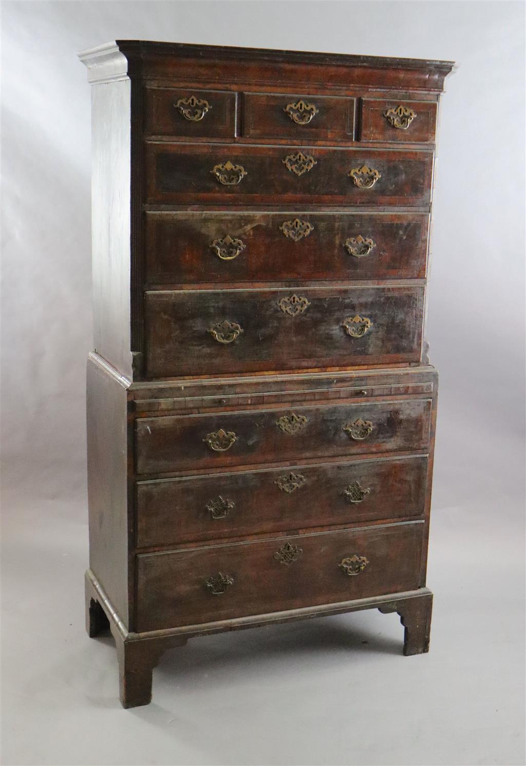 A mid 18th century featherbanded walnut chest on chest, W.3ft 6in. D.1ft 9in. H.6ft 2.5in.